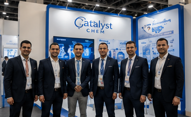 Catalyst Chem team standing at the exhibition booth